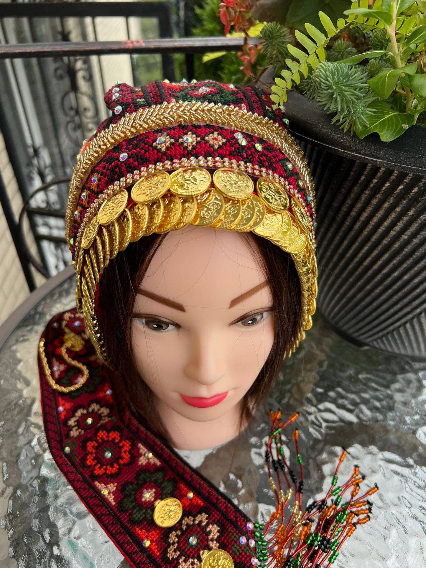 Waqaya with gold-plated coins